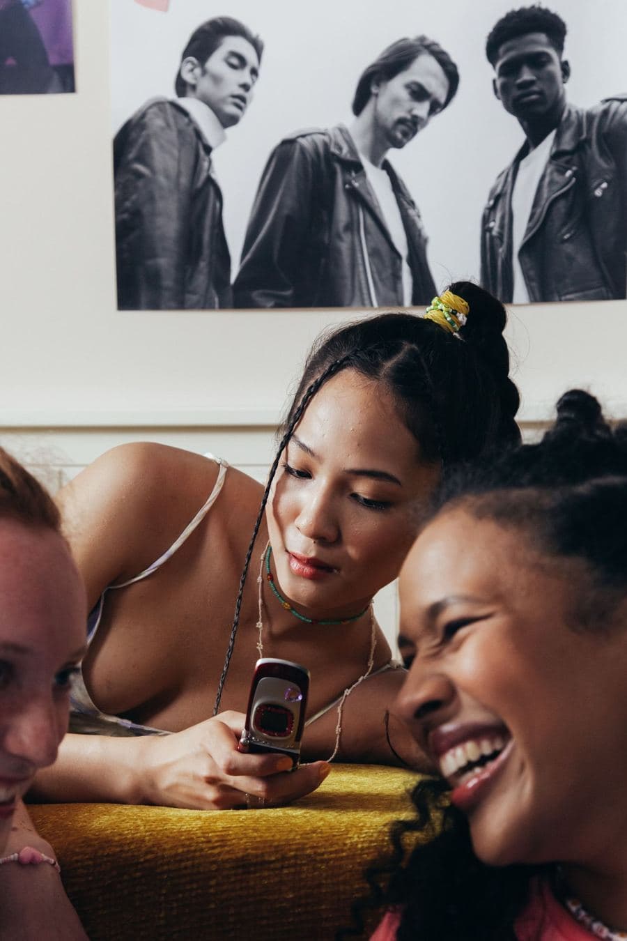 Friends laughing at their phones