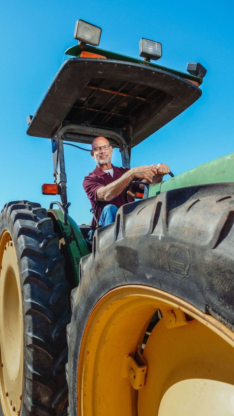 Farmer driving a tractor